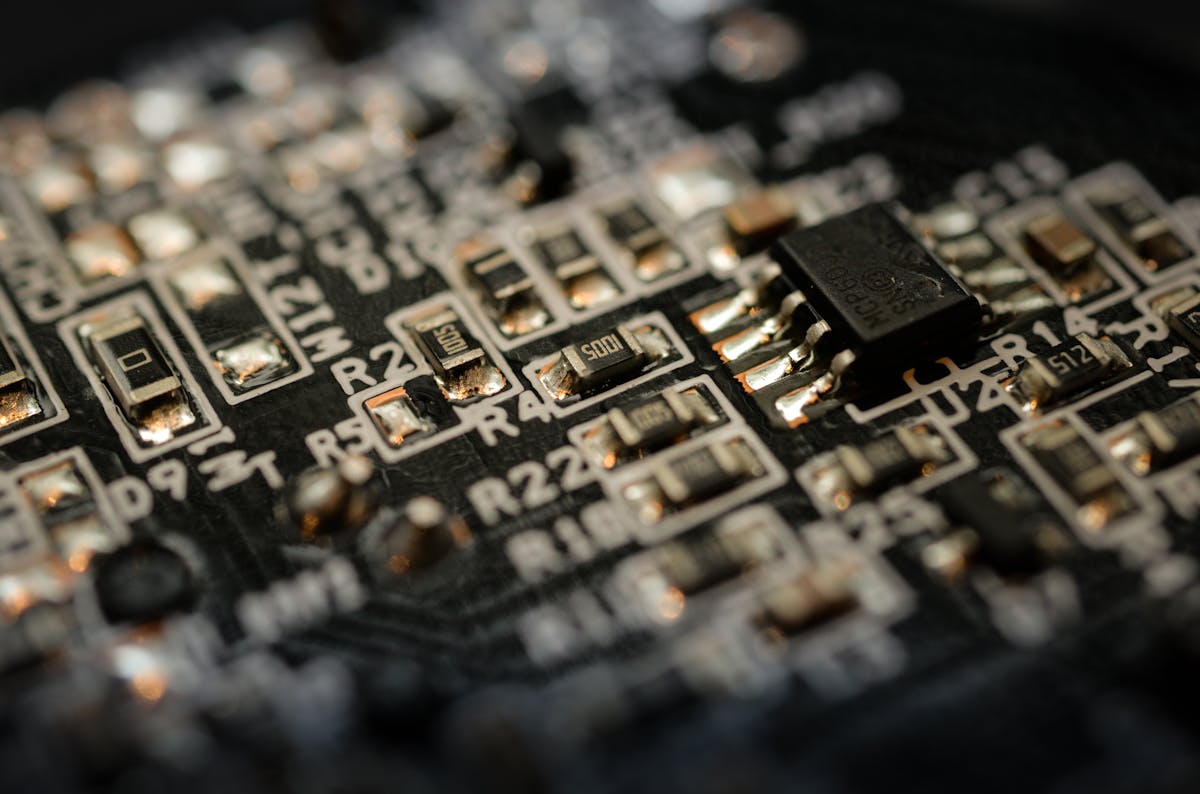 Macro shot of a circuit board with warm-lit components